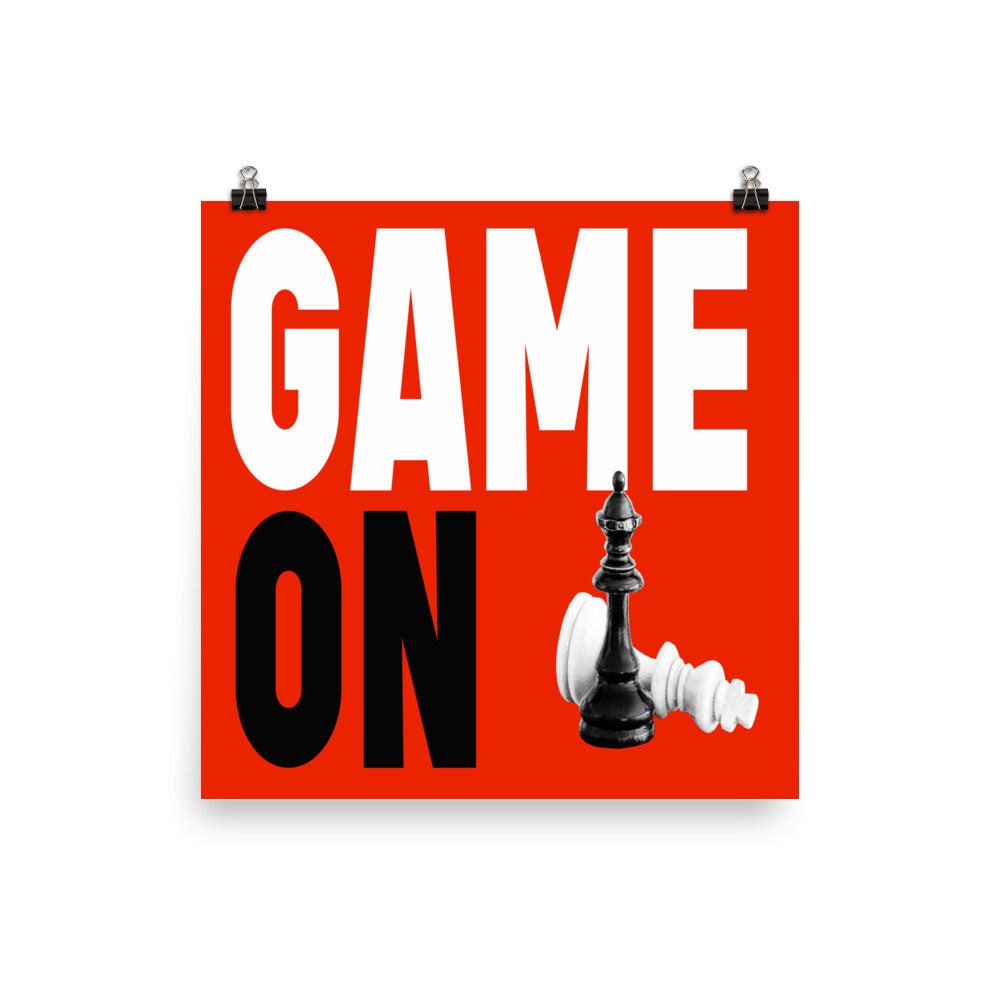 Block letters of Game On on blue background with king and queen game pieces on poster. 